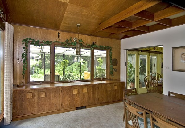 The dining room's built-in sideboard, and a view to the sun room beyond.